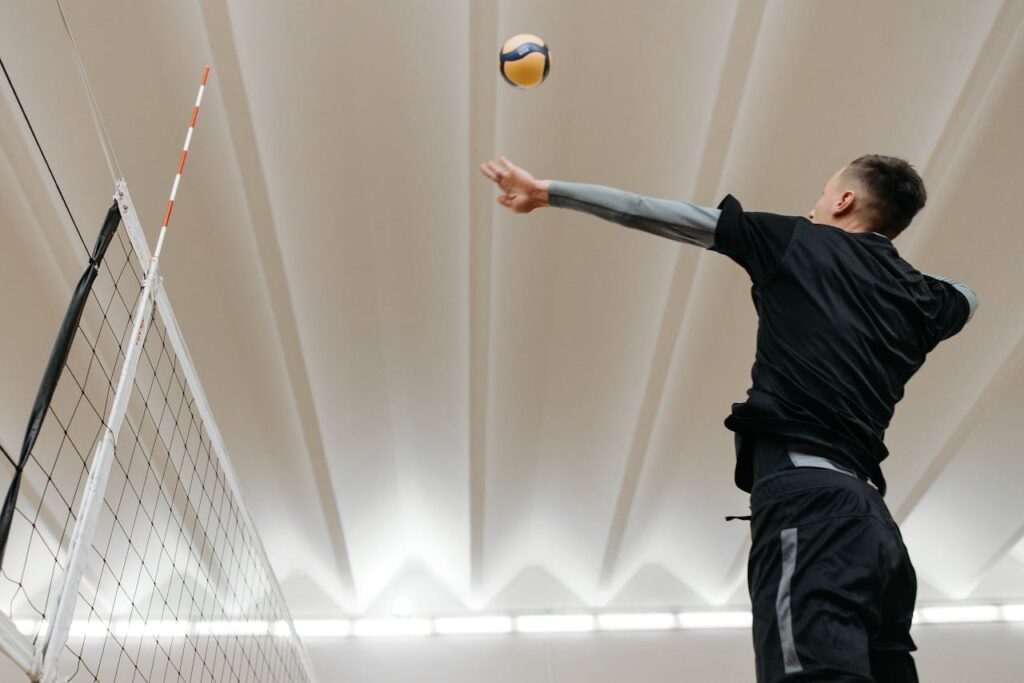 Low-Angle Shot of a Man Playing Volleyball